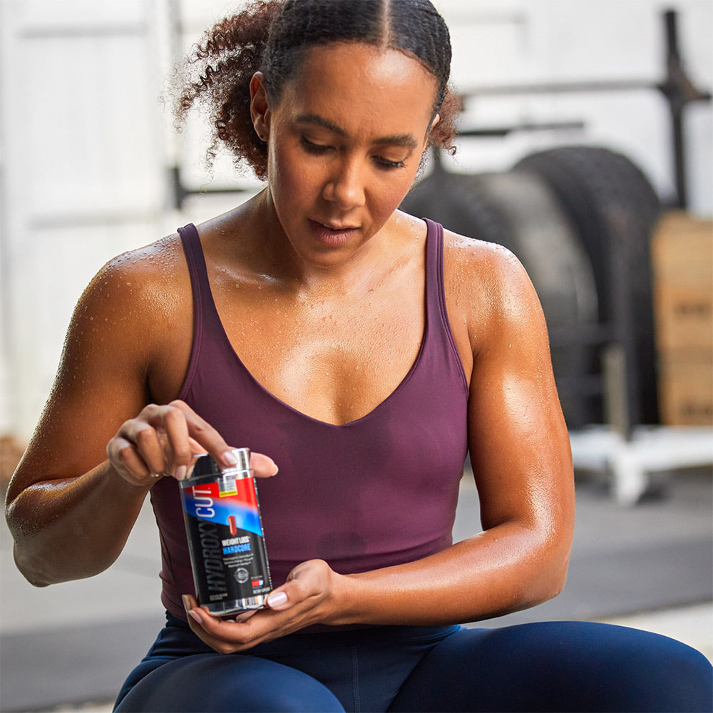 Stefanie holding a bottle of Hydroxycut Hardcore
