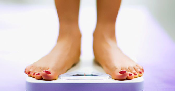 close up of an individual standing on the scale