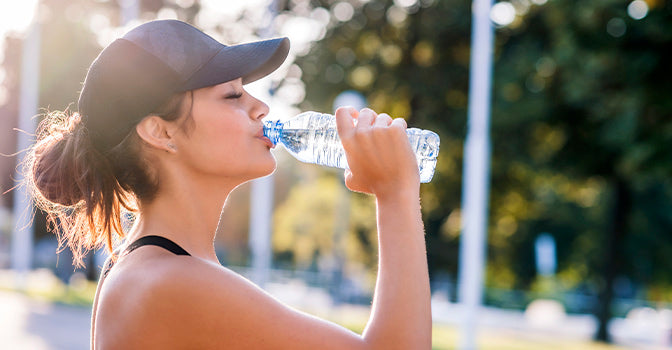 Woman drinking water from a bottle